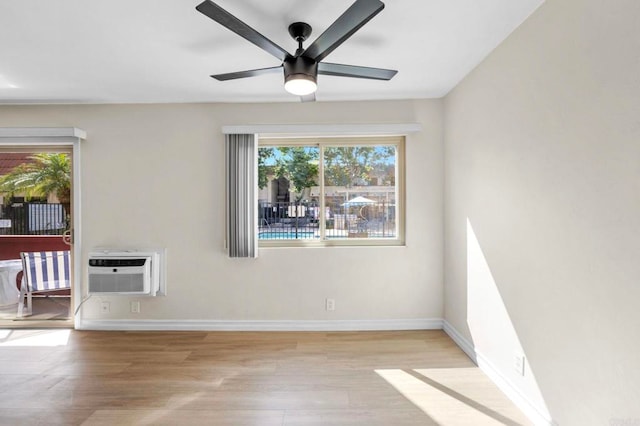 8649 Lake Murray Blvd Unit 4, San Diego, CA 92119 - spare room with a wall mounted AC, healthy amount of natural light, light wood-style flooring, and ceiling fan