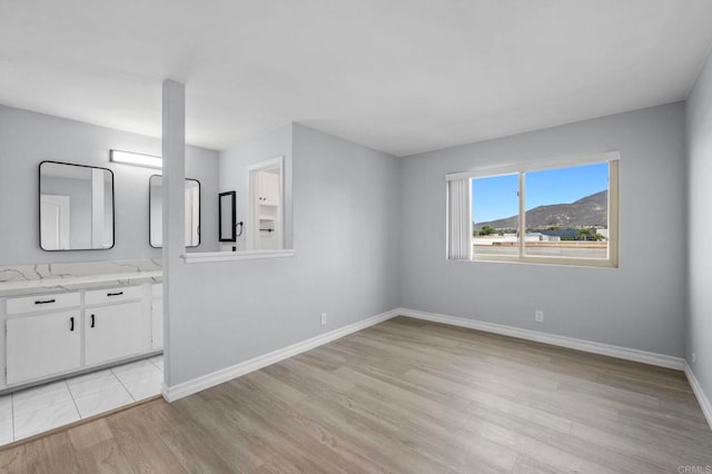 8649 Lake Murray Blvd Unit 4, San Diego, CA 92119 - unfurnished bedroom featuring light wood-style floors and baseboards