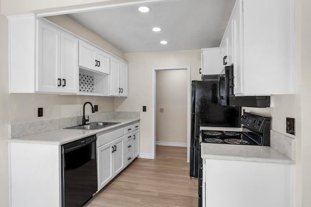 8649 Lake Murray Blvd Unit 4, San Diego, CA 92119 - kitchen featuring black appliances, light wood-style flooring, white cabinets, light countertops, and recessed lighting