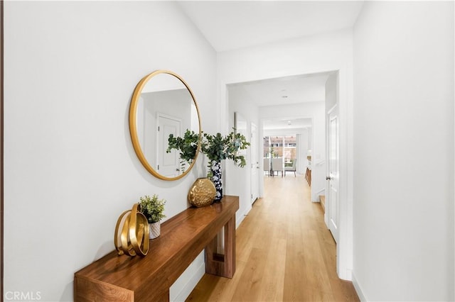 112 Velvet Leaf, Irvine, CA 92620 - hallway with light wood-type flooring and baseboards