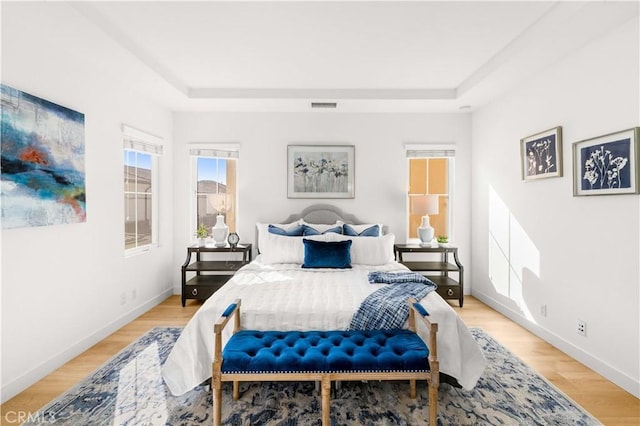 112 Velvet Leaf, Irvine, CA 92620 - bedroom with a raised ceiling and light wood-type flooring
