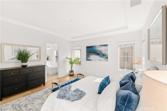 112 Velvet Leaf, Irvine, CA 92620 - bedroom with a tray ceiling, light wood-type flooring, and ensuite bathroom