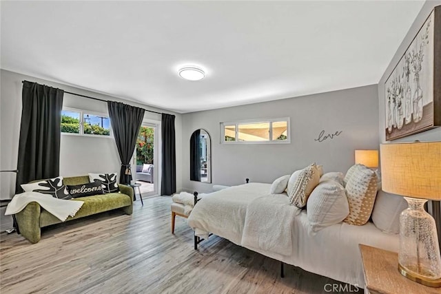 10912 Nighthawk Cir, Fountain Valley, CA 92708 - bedroom featuring wood finished floors and access to outside
