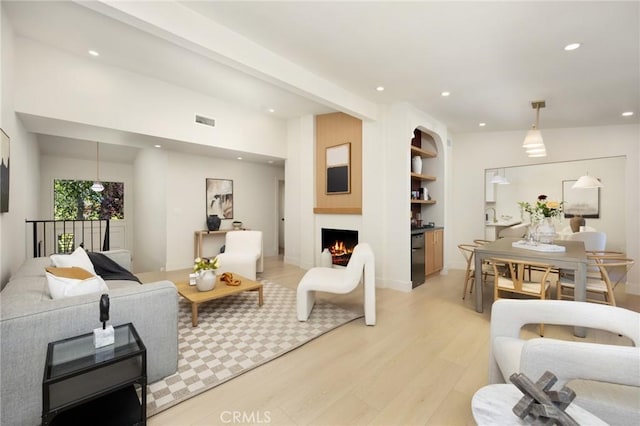 45 Oaktree Ln, Rolling Hills Estates, CA 90274 - living room featuring light wood-type flooring, recessed lighting, and a lit fireplace