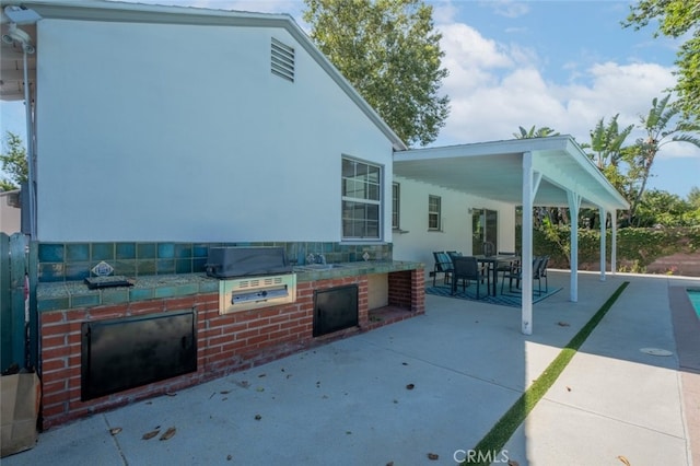 6535 Comanche Ave, Winnetka, CA 91306 - view of patio featuring exterior kitchen and outdoor dining area