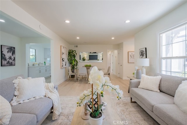 6535 Comanche Ave, Winnetka, CA 91306 - living area with plenty of natural light, light wood-style flooring, and recessed lighting