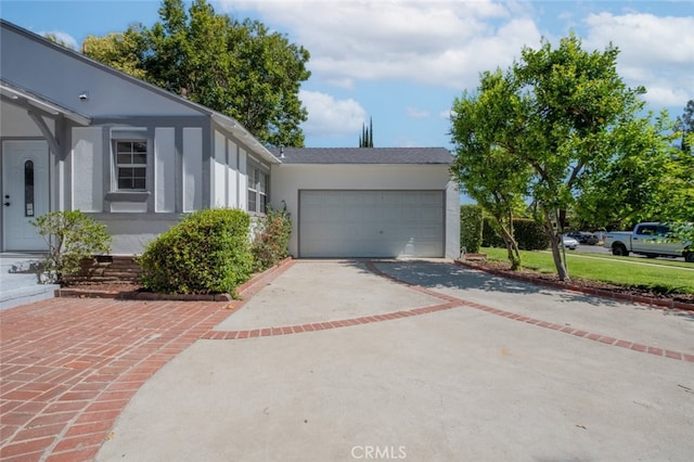 6535 Comanche Ave, Winnetka, CA 91306 - ranch-style home featuring concrete driveway, stucco siding, and an attached garage