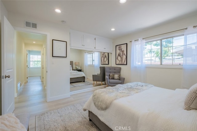 6535 Comanche Ave, Winnetka, CA 91306 - bedroom with multiple windows, recessed lighting, and light wood-style floors