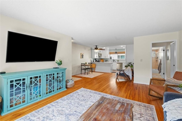 5160 Atherton Unit 73, Long Beach, CA 90815 - living area with light wood-style flooring and ceiling fan