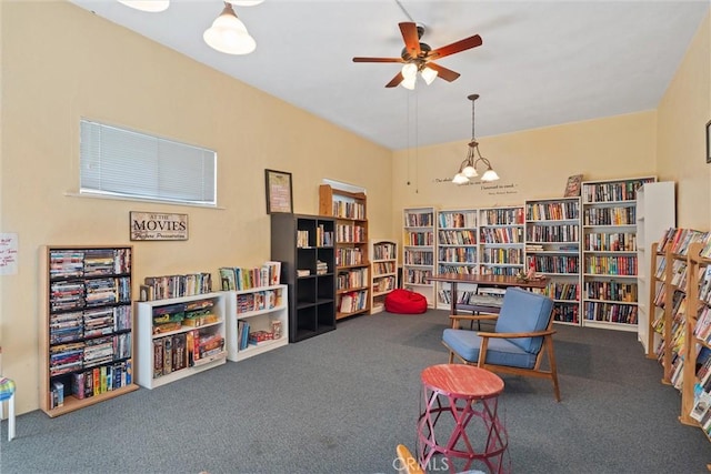 5160 Atherton Unit 73, Long Beach, CA 90815 - living area featuring bookshelves, carpet flooring, a ceiling fan, and a chandelier