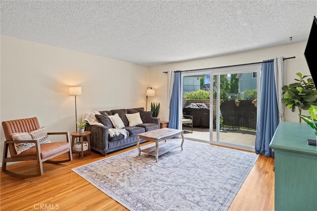 5160 Atherton Unit 73, Long Beach, CA 90815 - living room with light wood-style floors and a textured ceiling