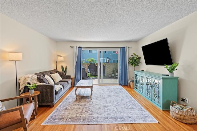5160 Atherton Unit 73, Long Beach, CA 90815 - living area featuring a textured ceiling and wood finished floors