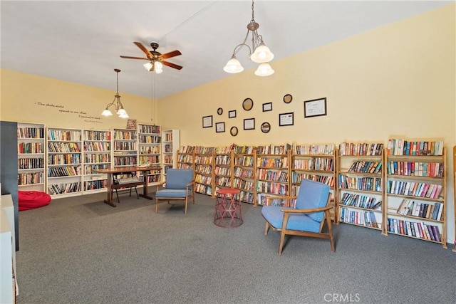 5160 Atherton Unit 73, Long Beach, CA 90815 - living area featuring bookshelves, carpet, and ceiling fan