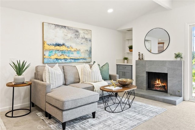 560 N Brea Blvd Unit 24, Brea, CA 92821 - living area with light colored carpet, vaulted ceiling, a fireplace, built in features, and recessed lighting