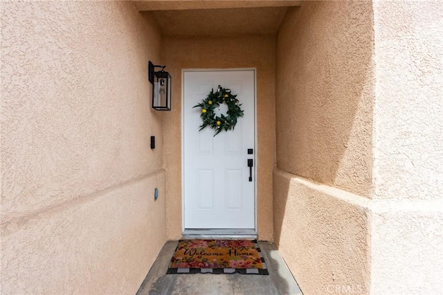 13432 Jubilee Pl, Victorville, CA 92395 - property entrance featuring stucco siding