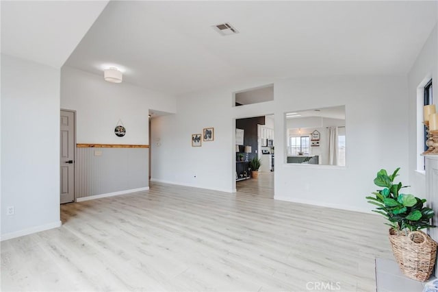 13432 Jubilee Pl, Victorville, CA 92395 - unfurnished living room featuring wood finished floors and vaulted ceiling