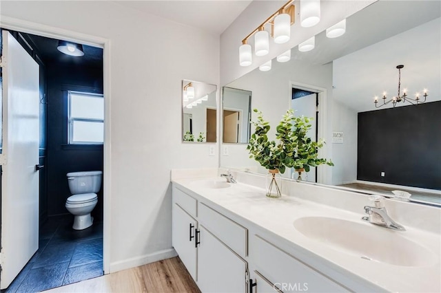 13432 Jubilee Pl, Victorville, CA 92395 - bathroom with double vanity and a chandelier