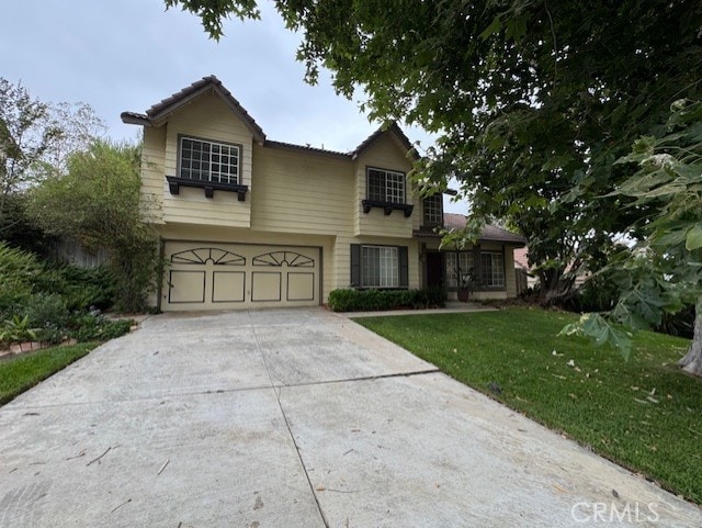 4773 Mount Rainier St, Jurupa Valley, CA 92509 - traditional home with a garage, driveway, and a front lawn