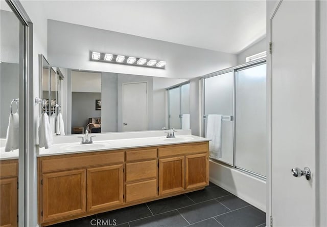 31397 Heitz Ln, Temecula, CA 92591 - bathroom featuring double vanity, tile patterned floors, connected bathroom, and shower / bath combination with glass door