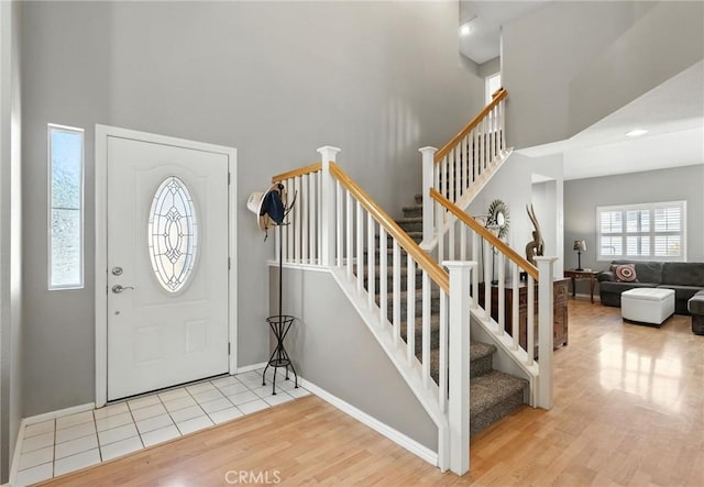 31397 Heitz Ln, Temecula, CA 92591 - foyer entrance featuring wood finished floors, a towering ceiling, and stairway