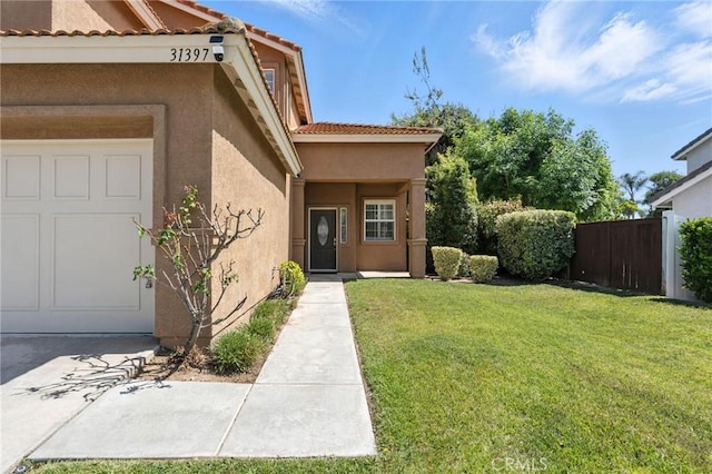 31397 Heitz Ln, Temecula, CA 92591 - view of exterior entry with stucco siding, a tile roof, and a garage