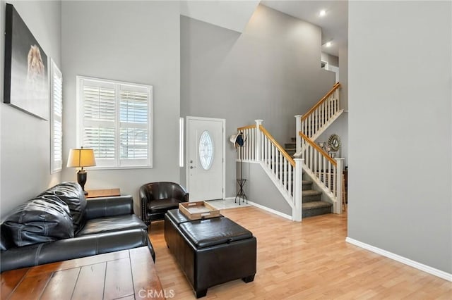 31397 Heitz Ln, Temecula, CA 92591 - living room featuring stairs, wood finished floors, and a towering ceiling