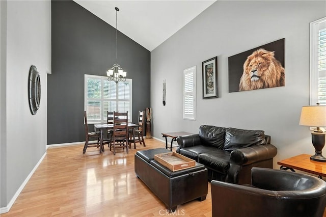 31397 Heitz Ln, Temecula, CA 92591 - living room with high vaulted ceiling, a chandelier, and light wood-type flooring