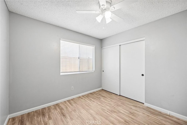 1422 Deborah Pl, Beaumont, CA 92223 - unfurnished bedroom featuring wood finished floors, a closet, a textured ceiling, and ceiling fan