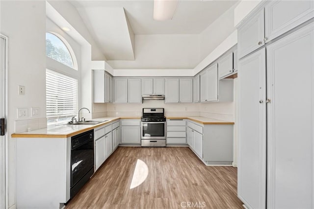 1422 Deborah Pl, Beaumont, CA 92223 - kitchen featuring gas range, under cabinet range hood, dishwasher, light wood-style flooring, and light countertops