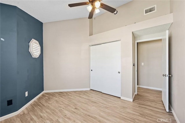 1422 Deborah Pl, Beaumont, CA 92223 - unfurnished bedroom featuring light wood-type flooring, a closet, a ceiling fan, and lofted ceiling