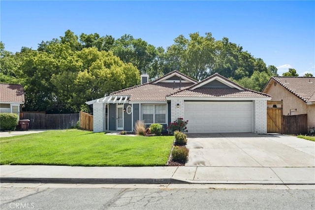 1422 Deborah Pl, Beaumont, CA 92223 - view of front facade with a garage, a tile roof, concrete driveway, and brick siding