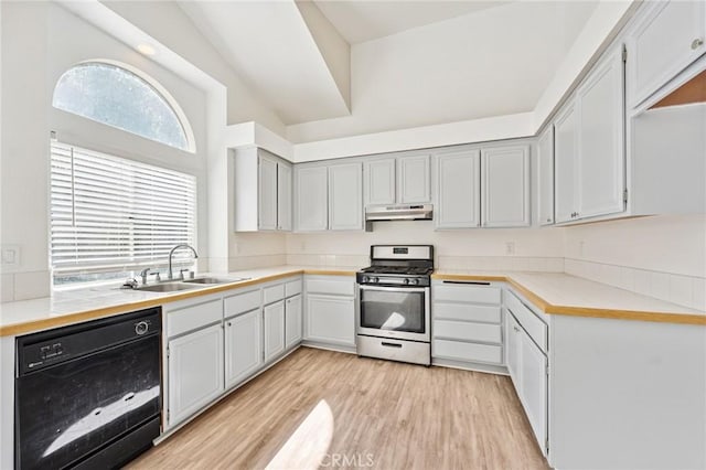 1422 Deborah Pl, Beaumont, CA 92223 - kitchen featuring black dishwasher, stainless steel gas stove, under cabinet range hood, light wood-type flooring, and light countertops