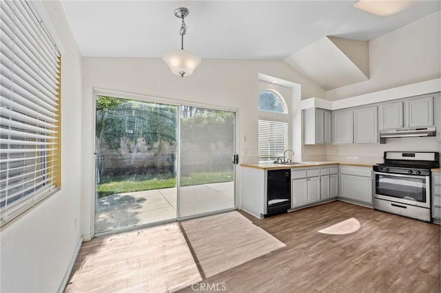 1422 Deborah Pl, Beaumont, CA 92223 - kitchen with stainless steel range with gas cooktop, under cabinet range hood, lofted ceiling, gray cabinets, and light countertops
