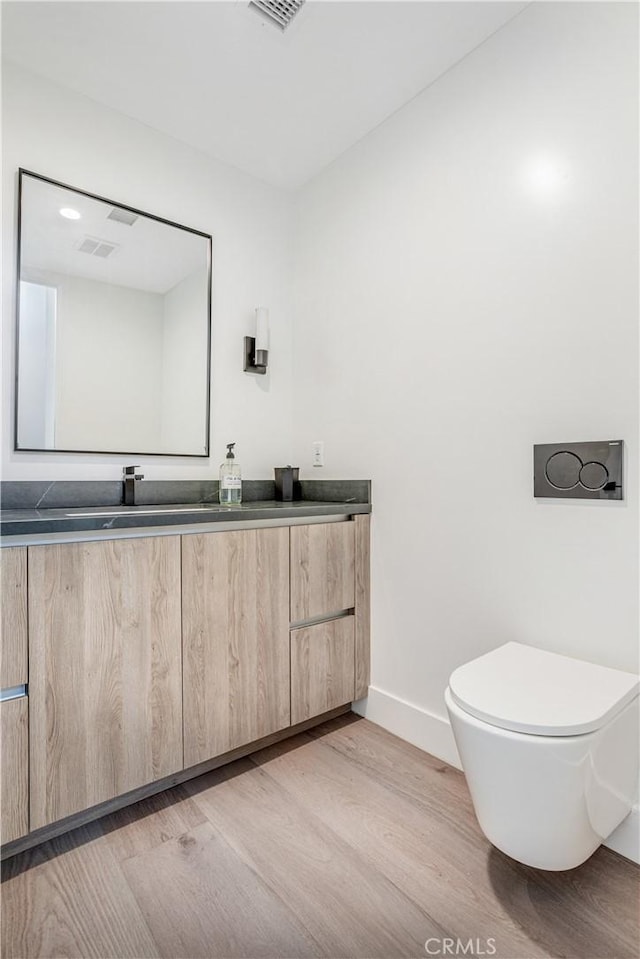 1567 Hi Point St, Los Angeles, CA 90035 - bathroom with double vanity and wood finished floors