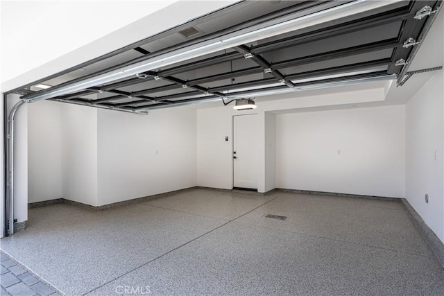 1567 Hi Point St, Los Angeles, CA 90035 - garage with a garage door opener and baseboards