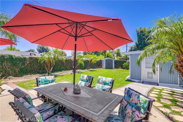 1332 Carew St, San Dimas, CA 91773 - fenced backyard featuring a storage shed, outdoor dining space, and a patio