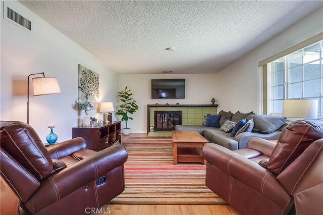 1332 Carew St, San Dimas, CA 91773 - living room with a textured ceiling and light wood finished floors
