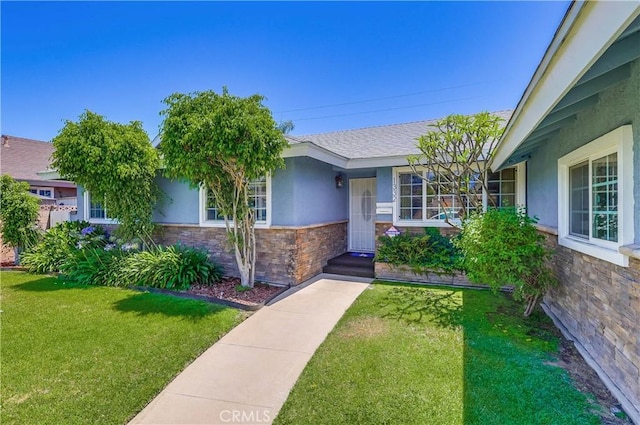 1332 Carew St, San Dimas, CA 91773 - view of front of house featuring stucco siding, stone siding, and a front yard