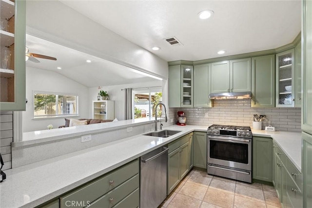 4187 County Road M, Orland, CA 95963 - kitchen with green cabinetry, appliances with stainless steel finishes, decorative backsplash, under cabinet range hood, and lofted ceiling