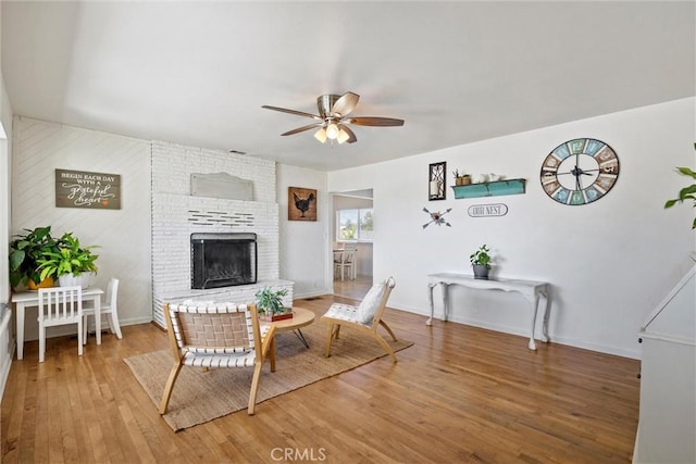 4187 County Road M, Orland, CA 95963 - living area featuring ceiling fan, wood finished floors, and a fireplace