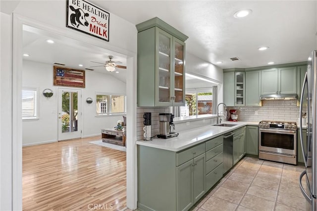 4187 County Road M, Orland, CA 95963 - kitchen with green cabinets, stainless steel appliances, under cabinet range hood, backsplash, and recessed lighting
