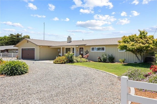 4187 County Road M, Orland, CA 95963 - ranch-style home featuring an attached garage, driveway, and a chimney
