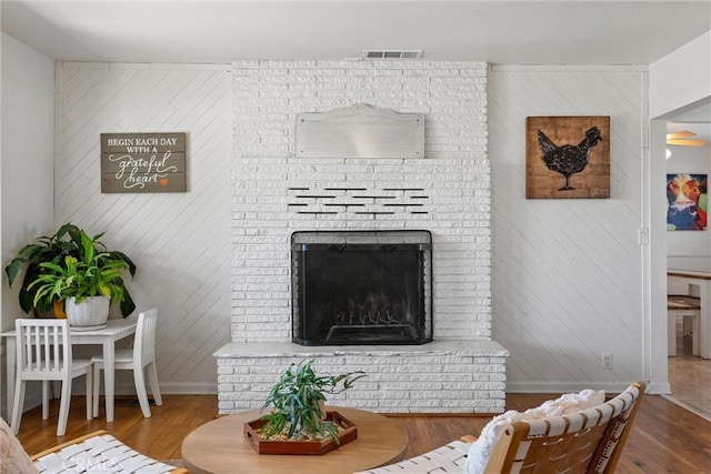 4187 County Road M, Orland, CA 95963 - living area featuring wood finished floors, wooden walls, and a fireplace