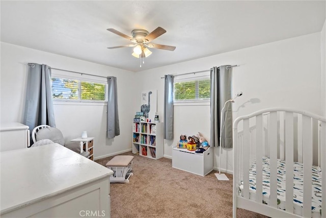 4187 County Road M, Orland, CA 95963 - bedroom with multiple windows, light carpet, ceiling fan, and a nursery area