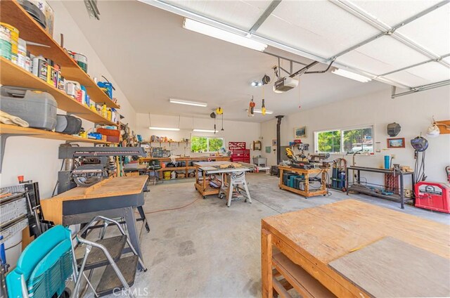 53235 Finegold Creek Ct, North Fork, CA 93643 - garage featuring a workshop area and a garage door opener