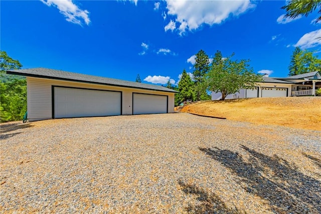 53235 Finegold Creek Ct, North Fork, CA 93643 - view of front facade featuring a detached garage and an outdoor structure
