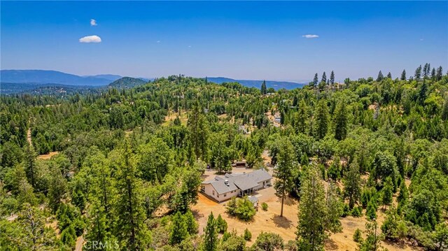 53235 Finegold Creek Ct, North Fork, CA 93643 - view from above of property with a heavily wooded area and a mountain backdrop