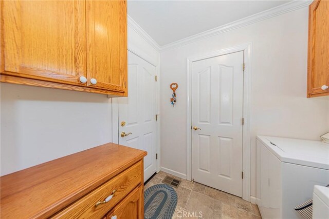 53235 Finegold Creek Ct, North Fork, CA 93643 - laundry room featuring cabinet space, ornamental molding, and washing machine and clothes dryer