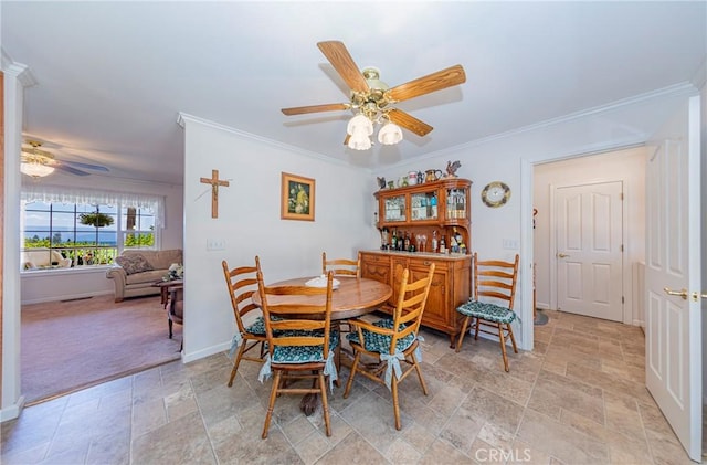53235 Finegold Creek Ct, North Fork, CA 93643 - dining space with ornamental molding, a ceiling fan, and light stone finish floors