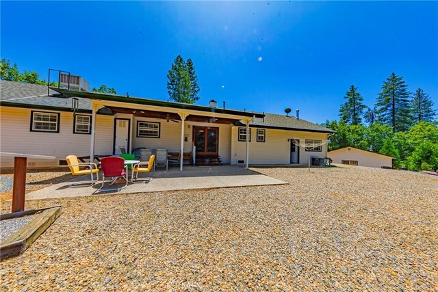 53235 Finegold Creek Ct, North Fork, CA 93643 - back of property featuring a patio and french doors